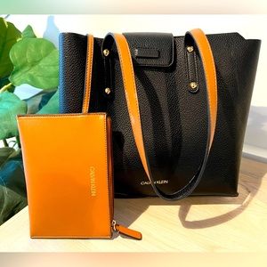 Calvin Klein black Leather bucket purse with zip pouch wallet. Used once!